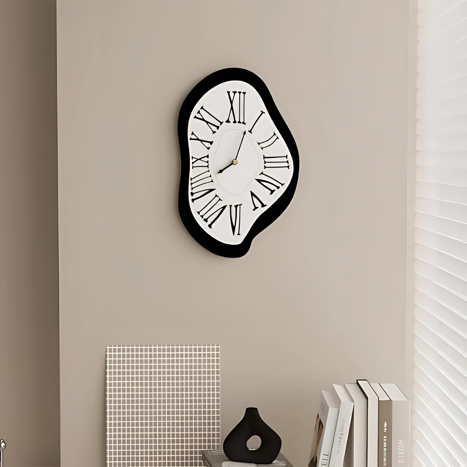 Surreal Salvador Dali Melting Wall Clock featuring a unique artistic design with a distorted, melting appearance reminiscent of the iconic Dali style, set against a backdrop that includes a grey wall and a wooden shelf.