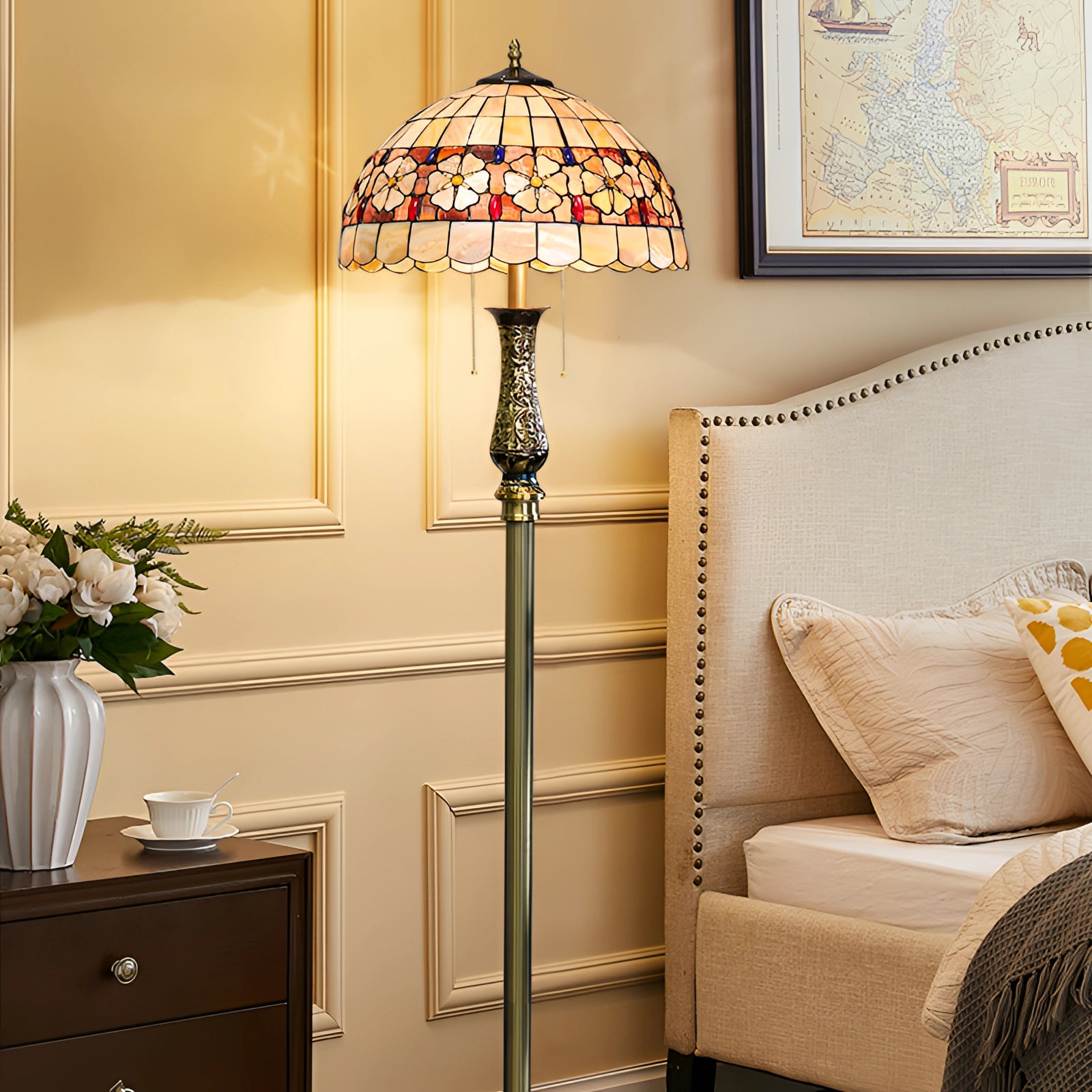 Tiffany-style dragonfly stained glass floor lamp with a brass pole, featuring a colorful stained glass shade and intricate dragonfly design, standing in a warm, inviting interior setting.