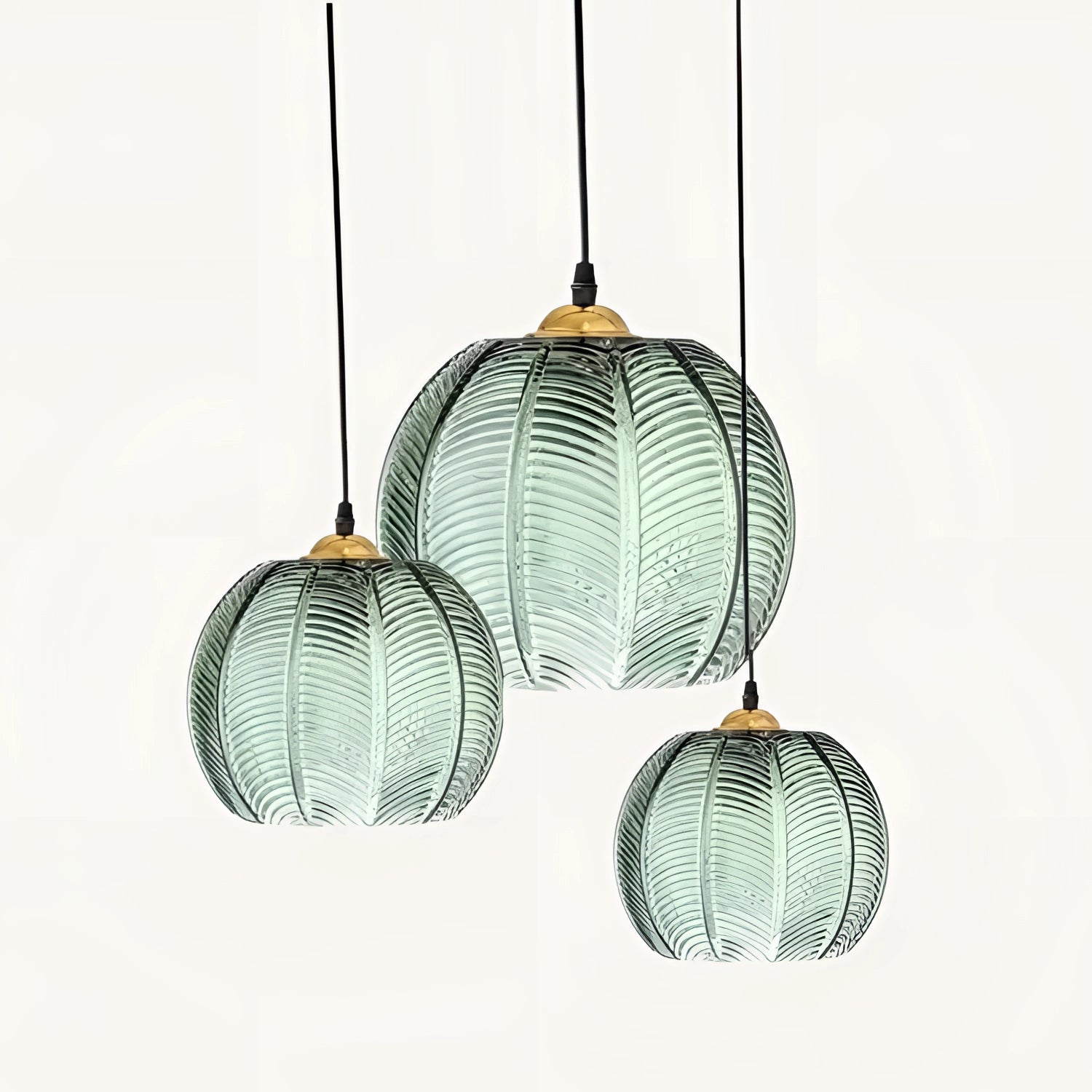 Tropical pendant light trio featuring luxury botanical leaf glass decor with artistic patterns and tints, resembling twigs and trees.