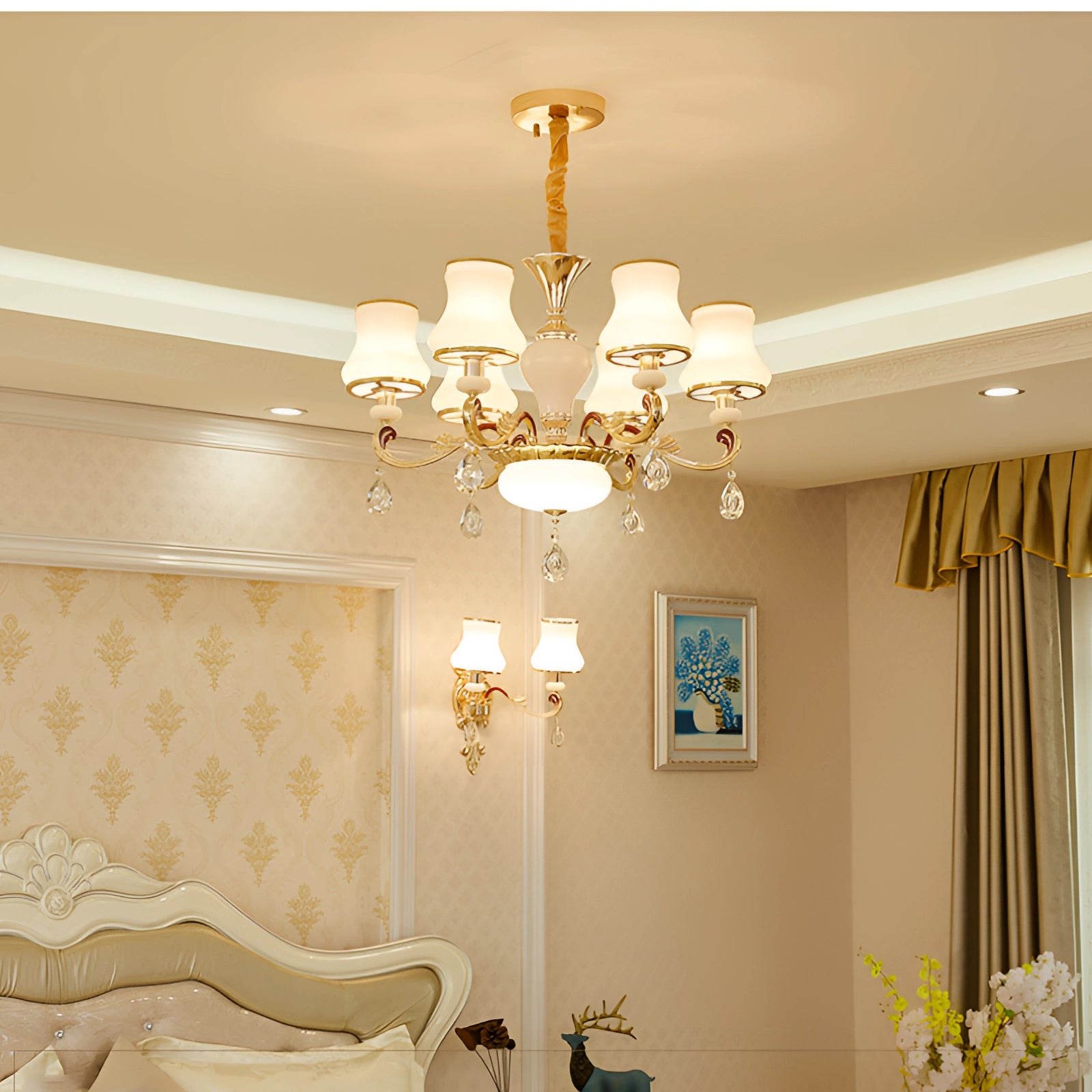 Vintage brass pendant light with an antique winged chandelier design featuring six lights, hanging from a ceiling in a stylishly decorated interior space with wooden elements and curtains.