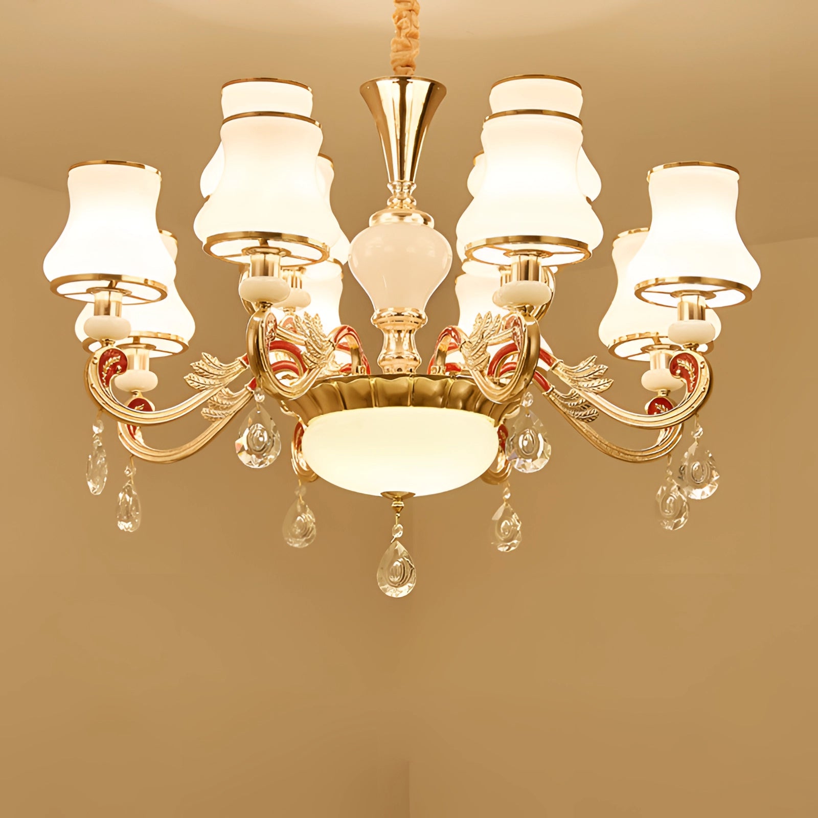 Vintage brass pendant light in an antique winged chandelier design with 12-light configuration, featuring metal construction and symmetrical detailing suitable for ceiling installation in interior design settings.