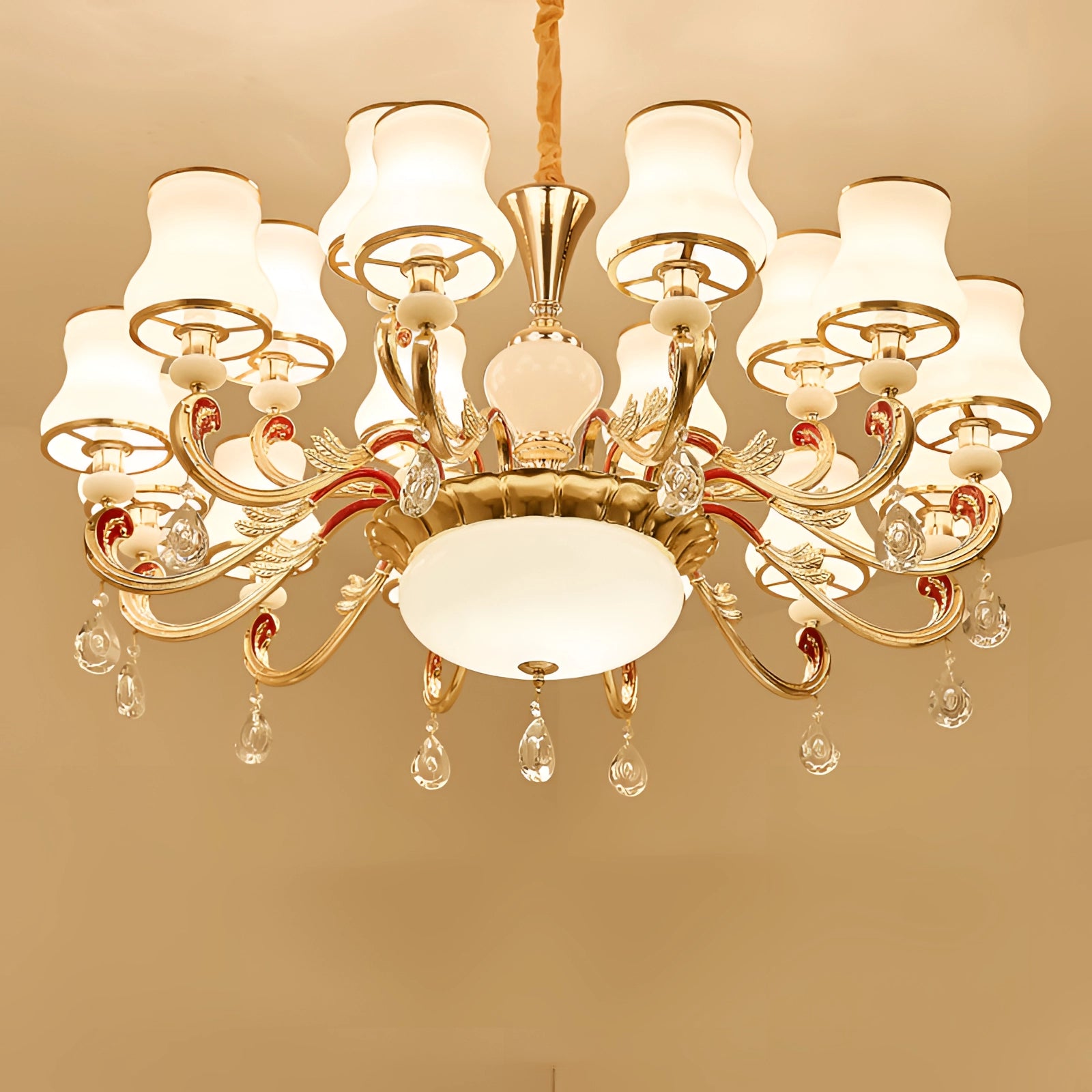 Vintage brass pendant light with an antique winged chandelier design featuring 18 lights, showcasing symmetrical metal craftsmanship and circular elements, hanging from the ceiling.
