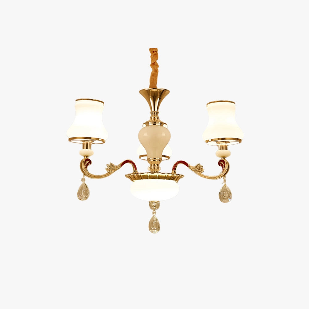 Vintage brass pendant light fixture with an antique winged chandelier design, featuring metal elements and a classic light bulb, elegantly hanging from a ceiling in an interior setting with wood accents.