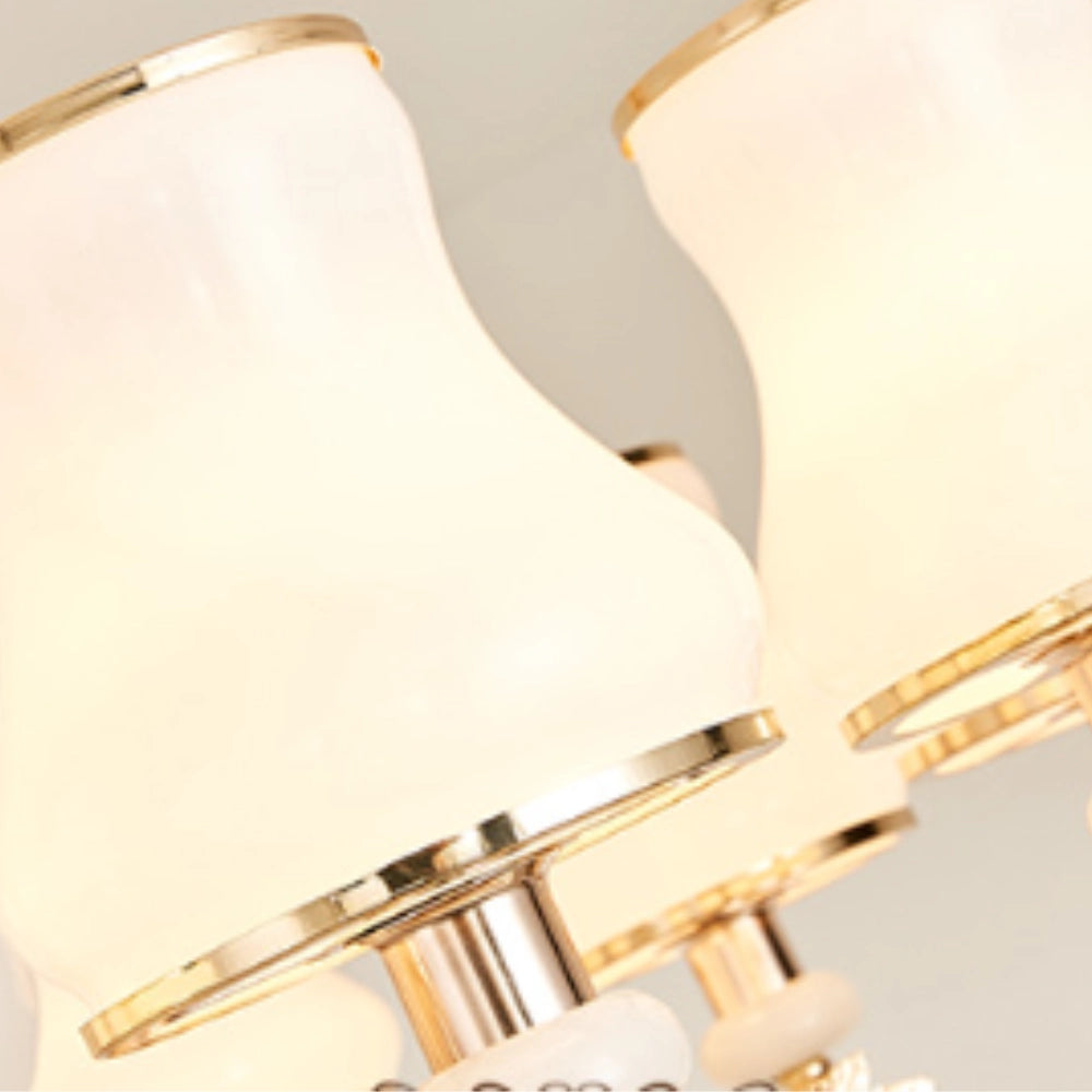 Vintage brass pendant light designed in the style of an antique winged chandelier, showcasing intricate metalwork and elegant craftsmanship.