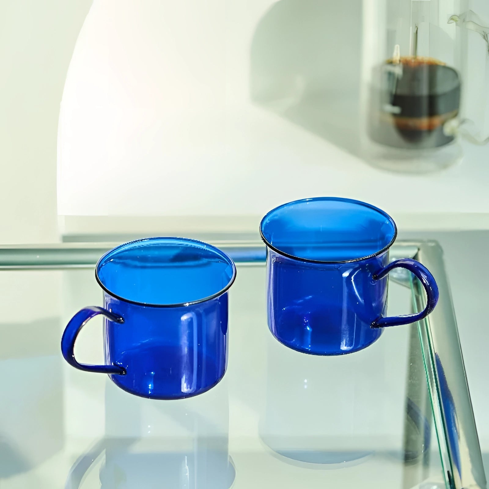 Vintage cobalt blue enamel mug set featuring a vibrant azure finish, ideal for durable outdoor drinkware and serving liquids.