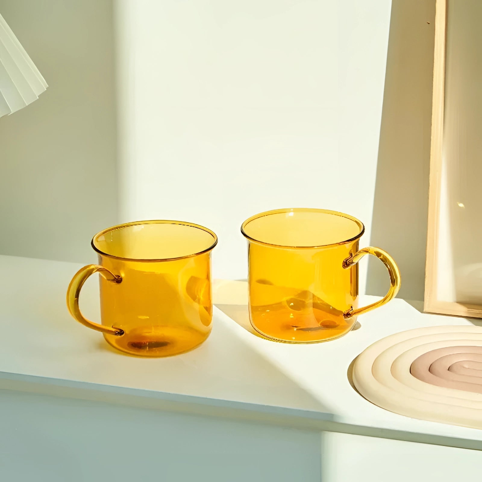 Vintage cobalt blue enamel mug set displayed in a sturdy, outdoor setting, showcasing their durability and vibrant color, suitable for coffee or tea, surrounded by complementary tableware and dishware.