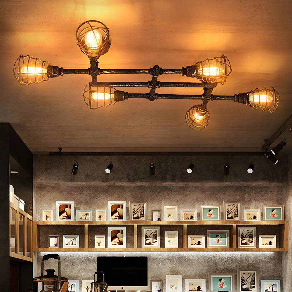 Vintage industrial ceiling light fixture with adjustable track heads in a rustic bronze finish, illuminating an interior space with warm amber lighting.
