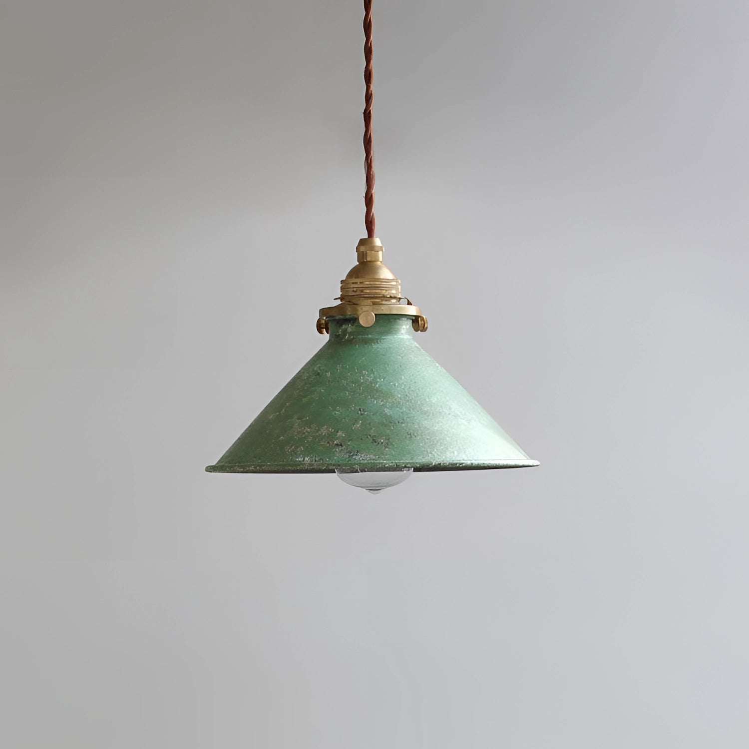Vintage industrial pendant light with an antique brass finish and distressed blue accents, featuring a symmetrical design with a cone-shaped shade and circular elements, measuring 8.3 inches.