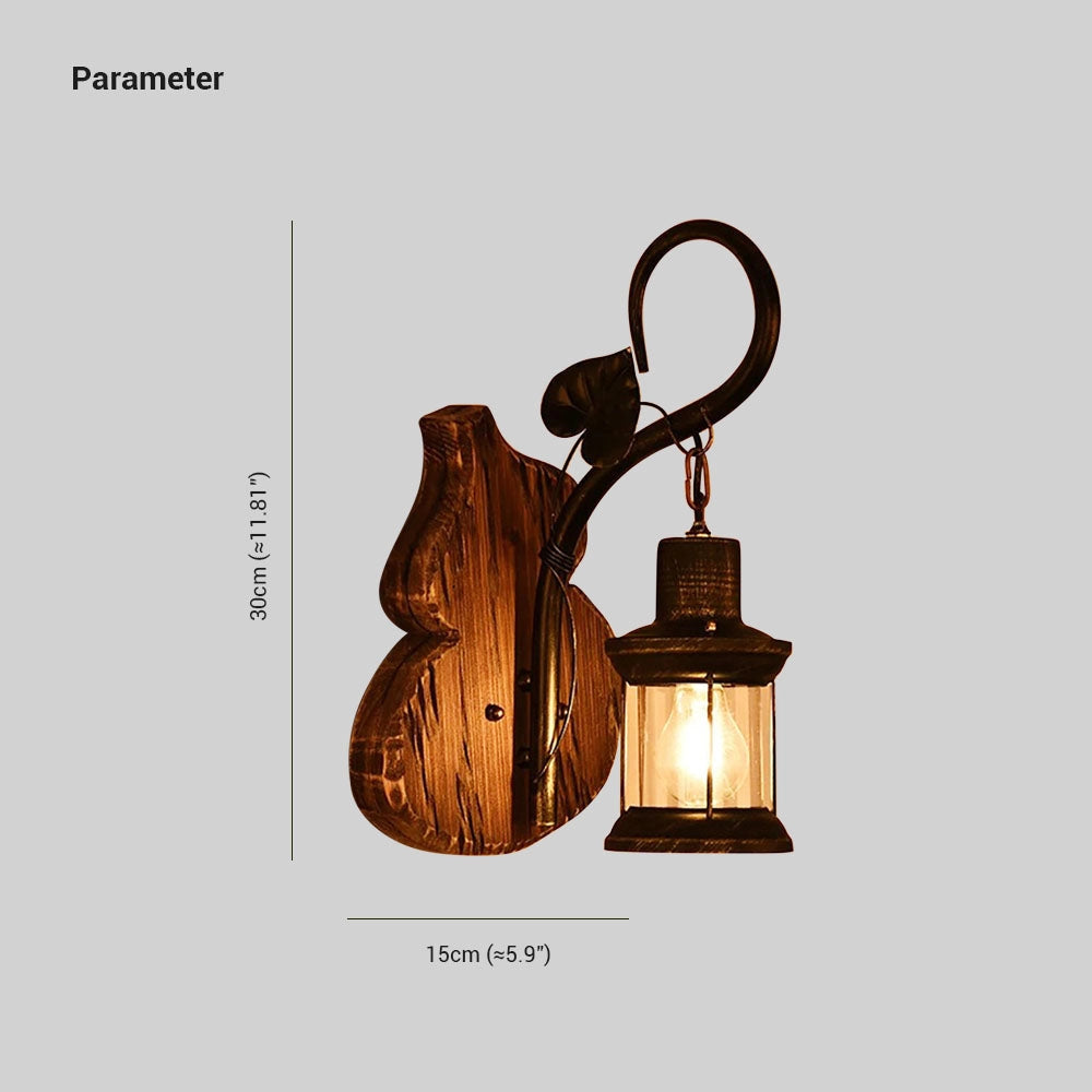 Vintage rustic wall lantern with an antique metal and wood design, featuring a sconce decor style with a visible light bulb.