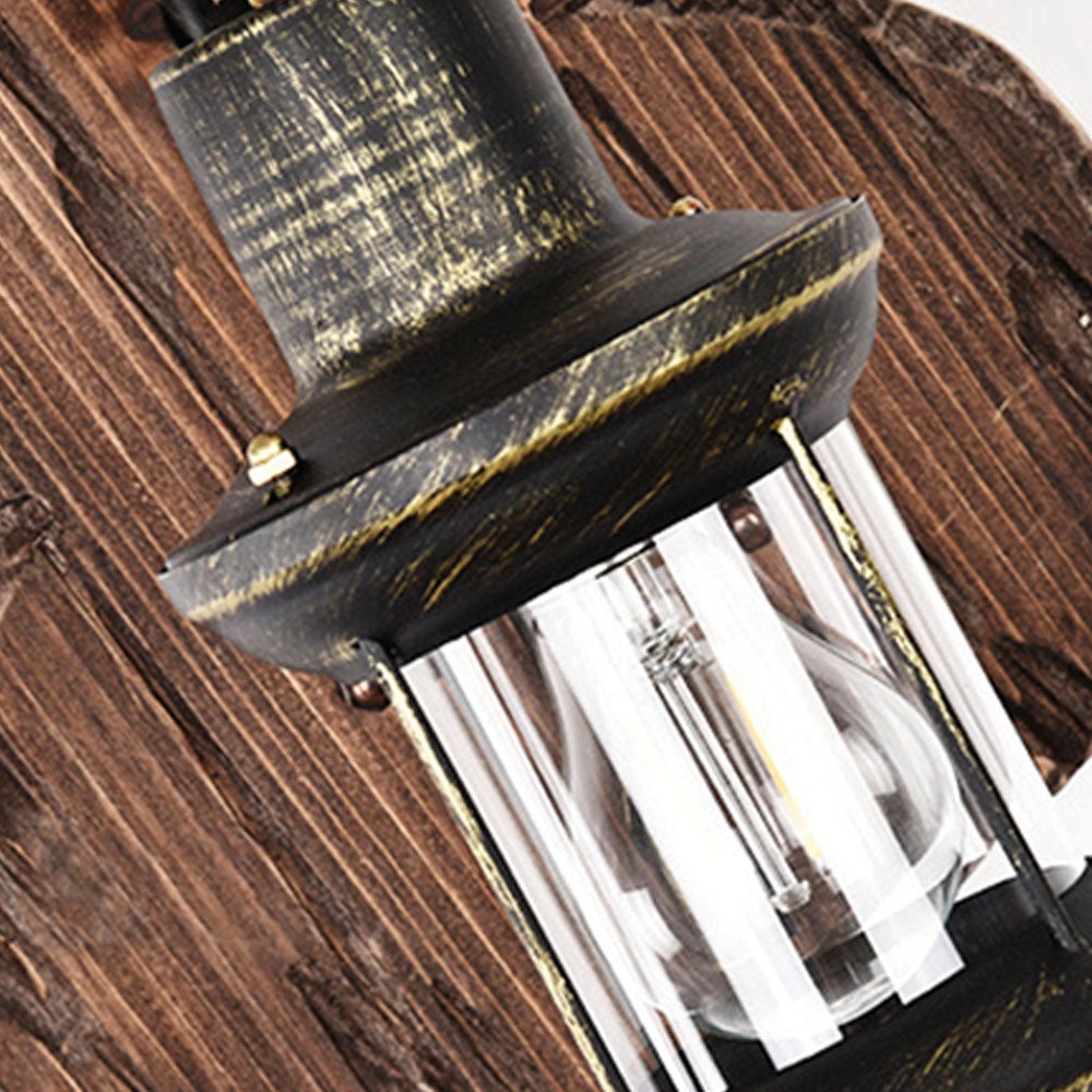 Vintage rustic wall lantern featuring an antique metal and wood design, used as a decorative sconce.