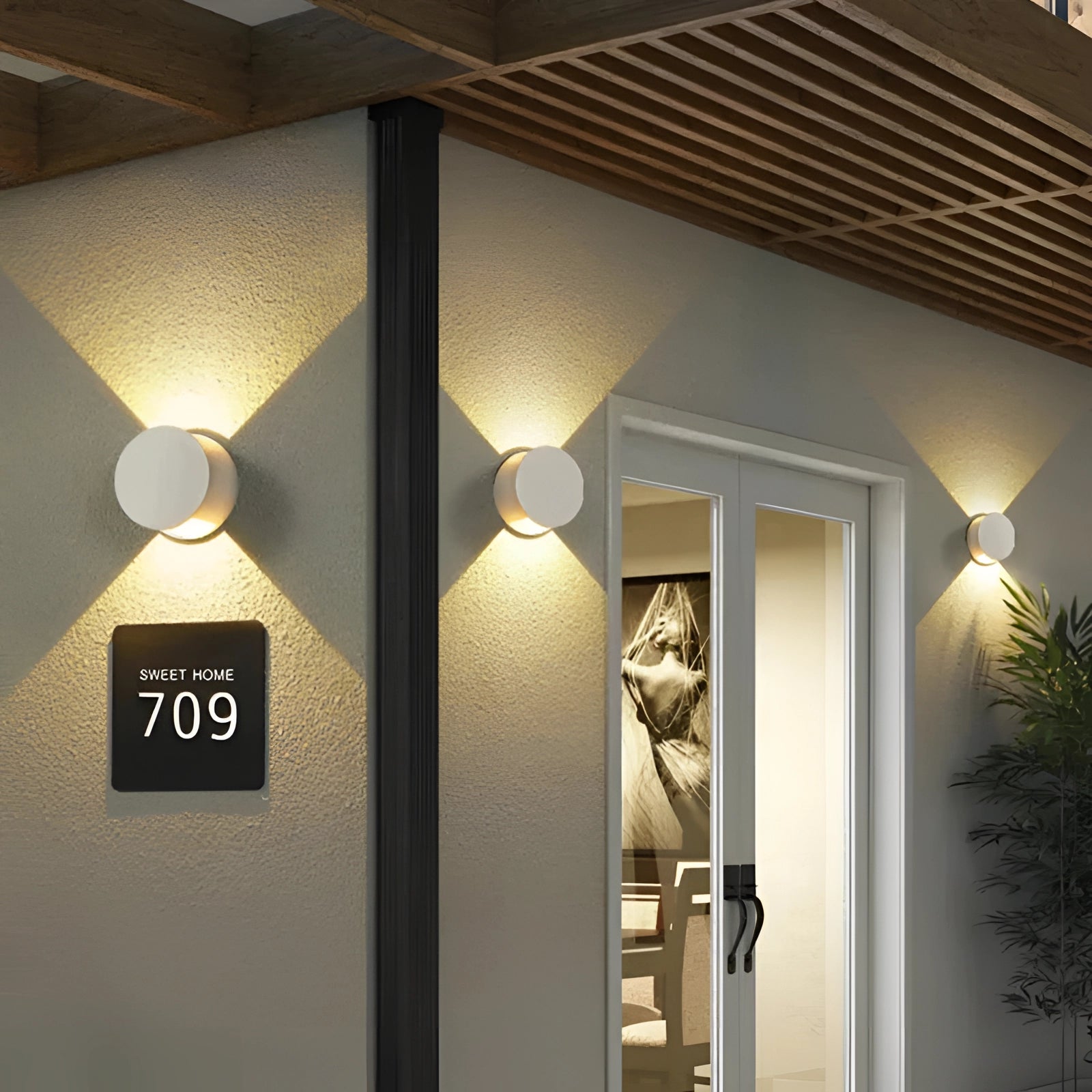 Modern waterproof LED outdoor wall sconce with a minimalist design, featuring a sleek glass shade and wood-like materials, perfect for energy-efficient exterior lighting.