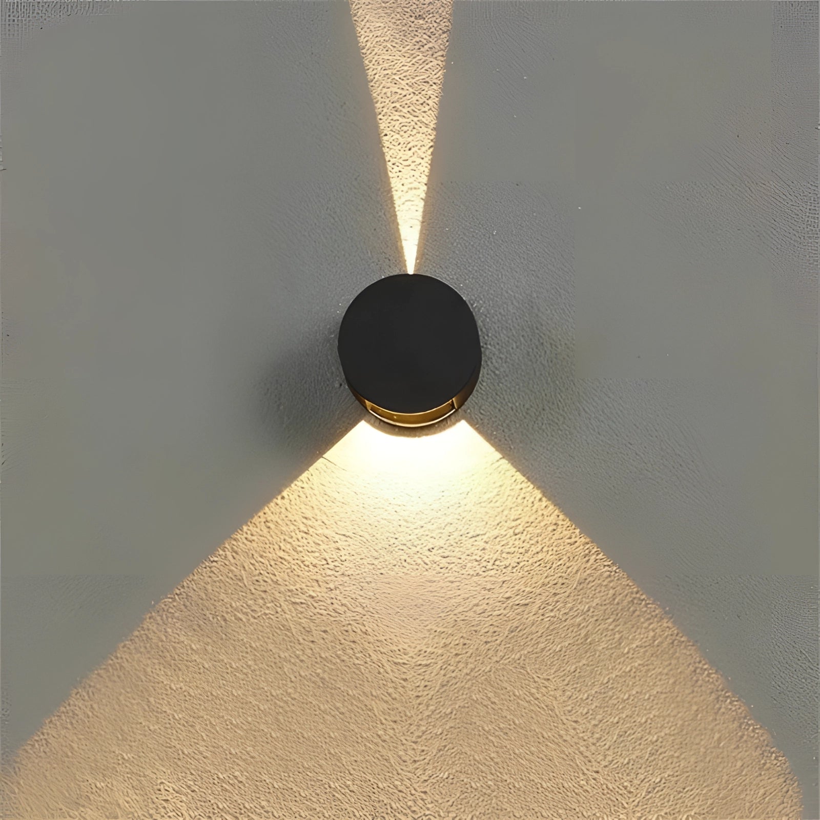 Modern black waterproof LED outdoor wall sconce featuring a cool white light, with a minimalist design that includes circular and symmetrical elements.