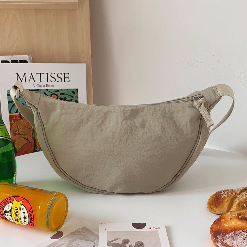 Crescent-shaped Crossbody Bag | Durable Polyester | Adjustable Strap | Compact & Organized Storage