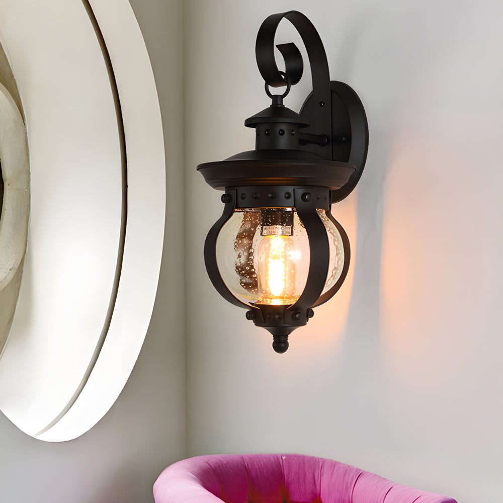 1-Light Black Outdoor Wall Lantern with Curved Arm and Seeded Glass Globe LED by Taavita