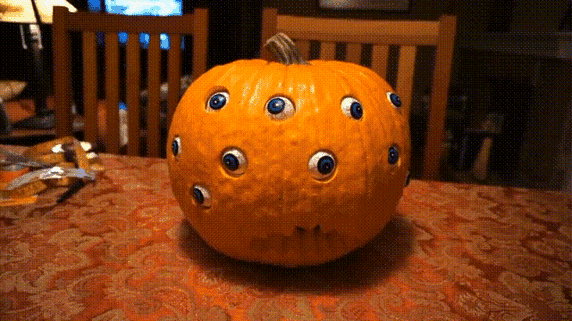 Spooky Halloween Pumpkin Decoration with Rotating Eyeballs