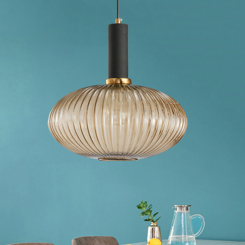 Black/Gold Cylinder/Oval/Capsule Pendant Lamp Modernist 1 Light Grey/Green/Amber Ribbed Glass Ceiling Light Fixture for Kitchen Gold Amber Capsule Clearhalo 'Ceiling Lights' 'Glass shade' 'Glass' 'Modern Pendants' 'Modern' 'Pendant Lights' 'Pendants' Lighting' 598297