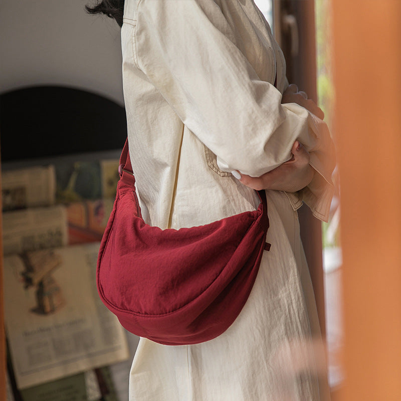 Crescent-shaped Crossbody Bag | Durable Polyester | Adjustable Strap | Compact & Organized Storage