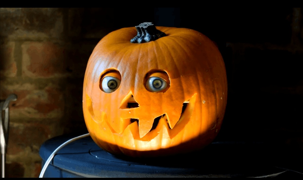 Spooky Halloween Pumpkin Decoration with Rotating Eyeballs