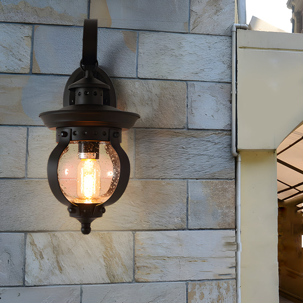 1-Light Seeded Glass Globe LED Outdoor Wall Lantern with Curved Arm | Dazuma