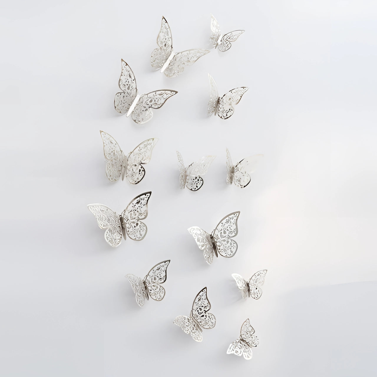 3D metallic butterfly wall art in silver, showcasing intricate details of a butterfly's wings and body, designed as a luxurious and elegant decoration piece.
