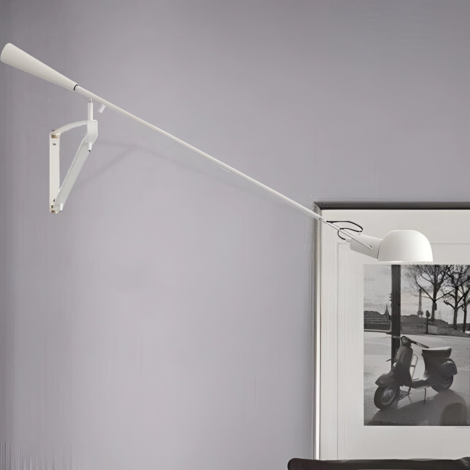Adjustable industrial swing arm wall lamp with a sleek black modern design, featuring a metal shade and arm, mounted on a wall in a room with a wooden ceiling.