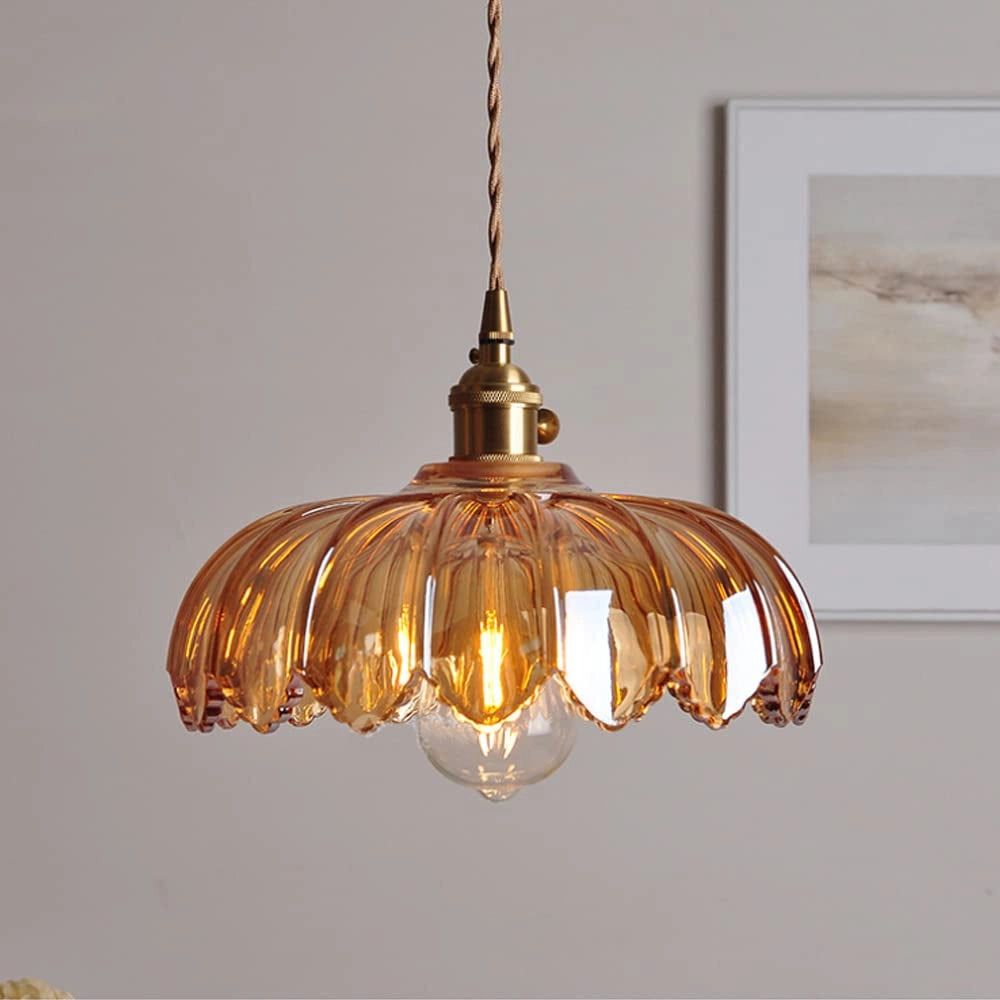 Amber glass floral pendant light with vintage brass finish, measuring 25 x 20 cm. The chandelier features a warm amber tint with a delicate floral design, complemented by a transparent glass material.