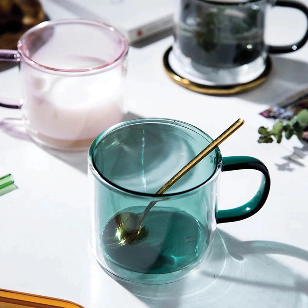 Amber glass mug placed on a table, designed for coffee and tea, showcasing its durable and heat-resistant construction.