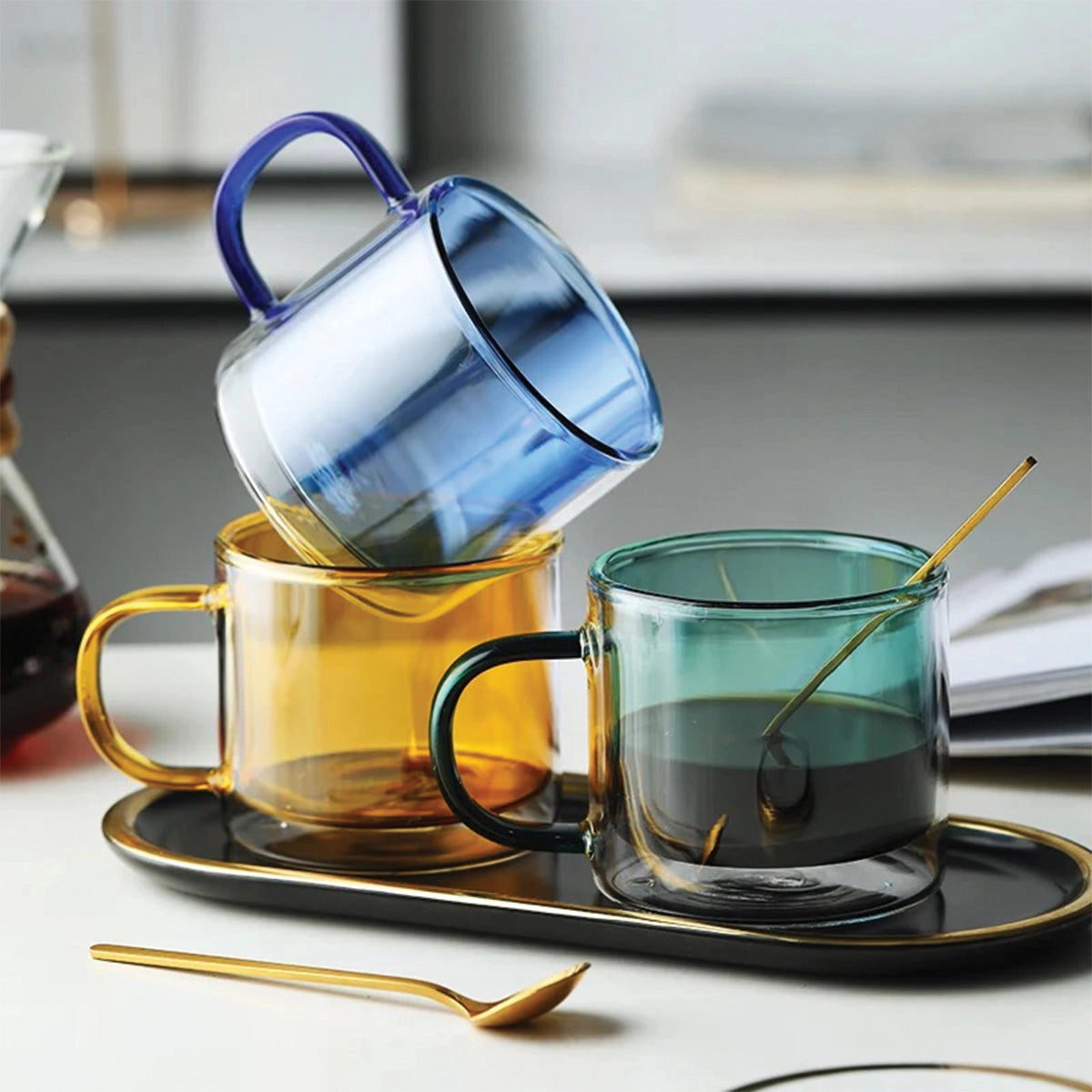 Amber glass mug for coffee or tea, showcasing its durable and heat-resistant design, set on a table.