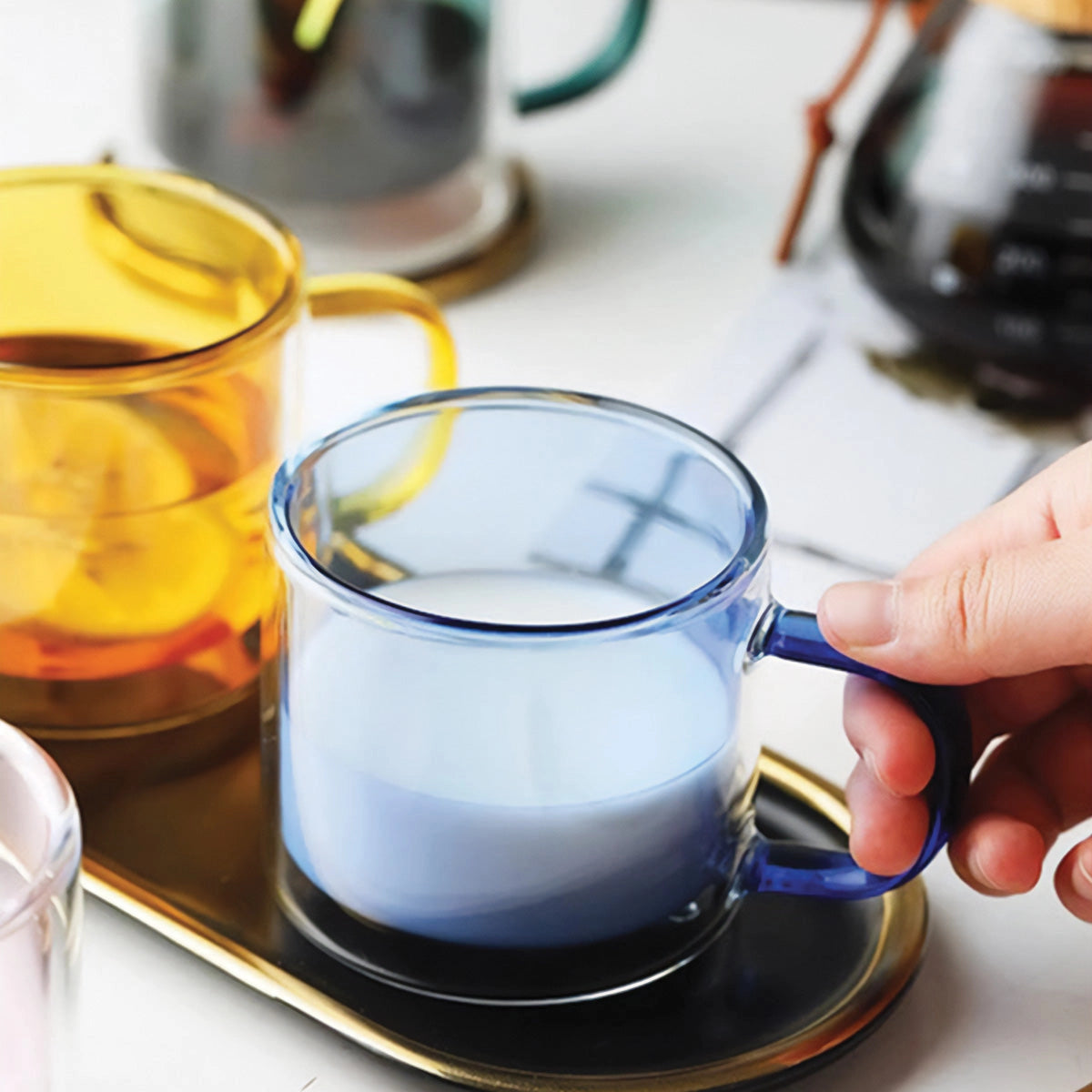 Amber glass mug filled with liquid, showcasing its durable and heat-resistant features, placed on a flat surface.