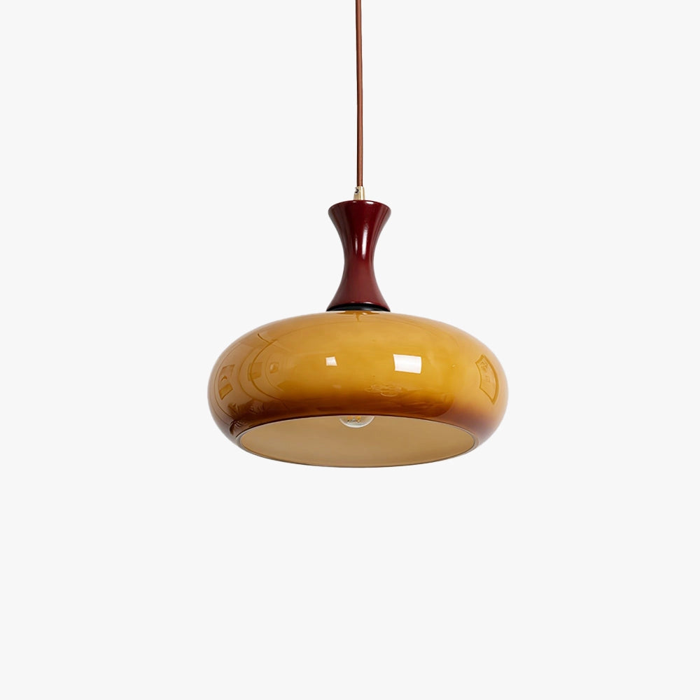 Amber glass retro pendant light with a mid-century modern design, featuring an oval shape and wooden accents, suspended from the ceiling as a stylish light fixture.