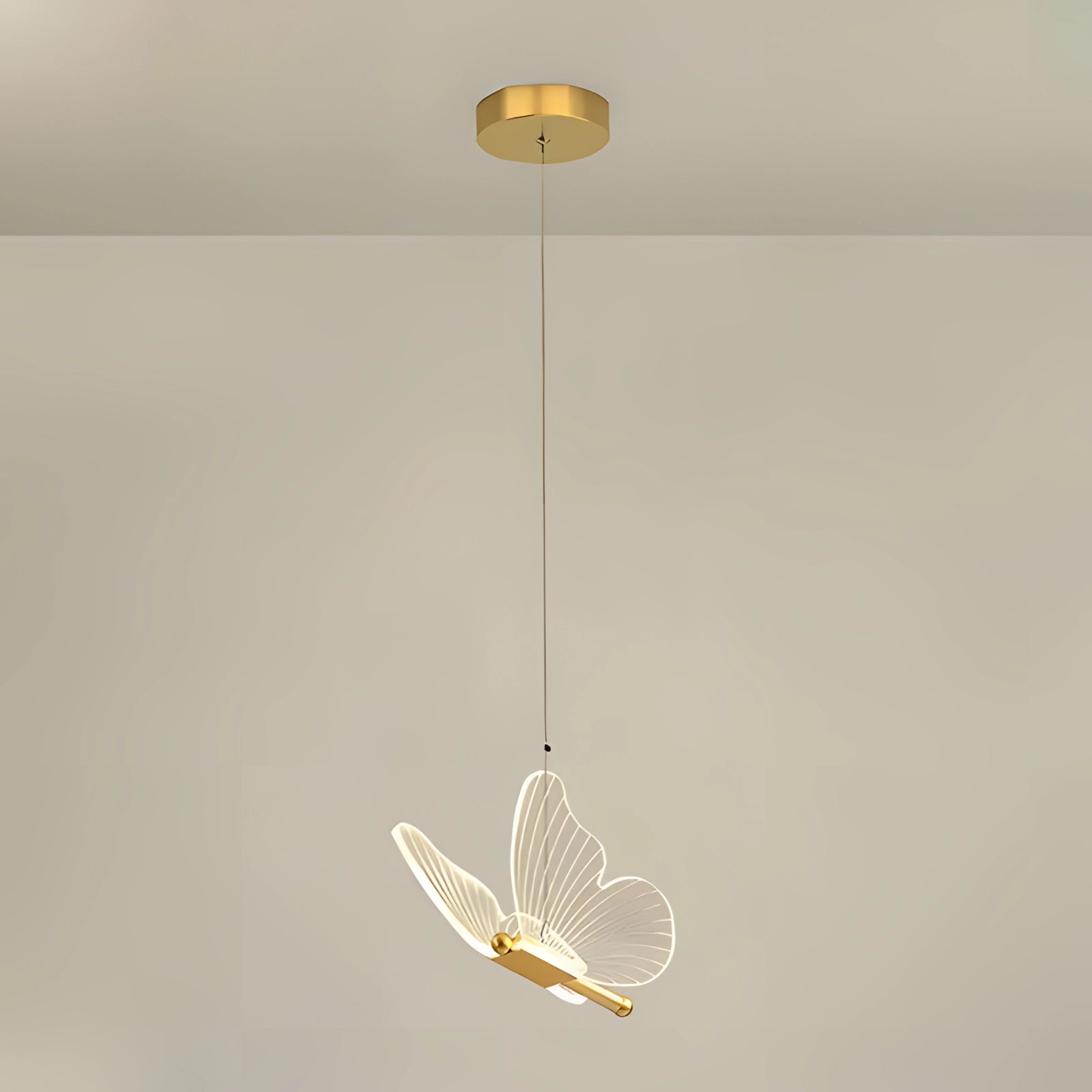 Modern Angel Wing LED Wall Sconce with a daylight bulb, featuring a sleek metal design resembling angel wings, mounted on a rectangular base, ideal for decorative bedroom lighting.