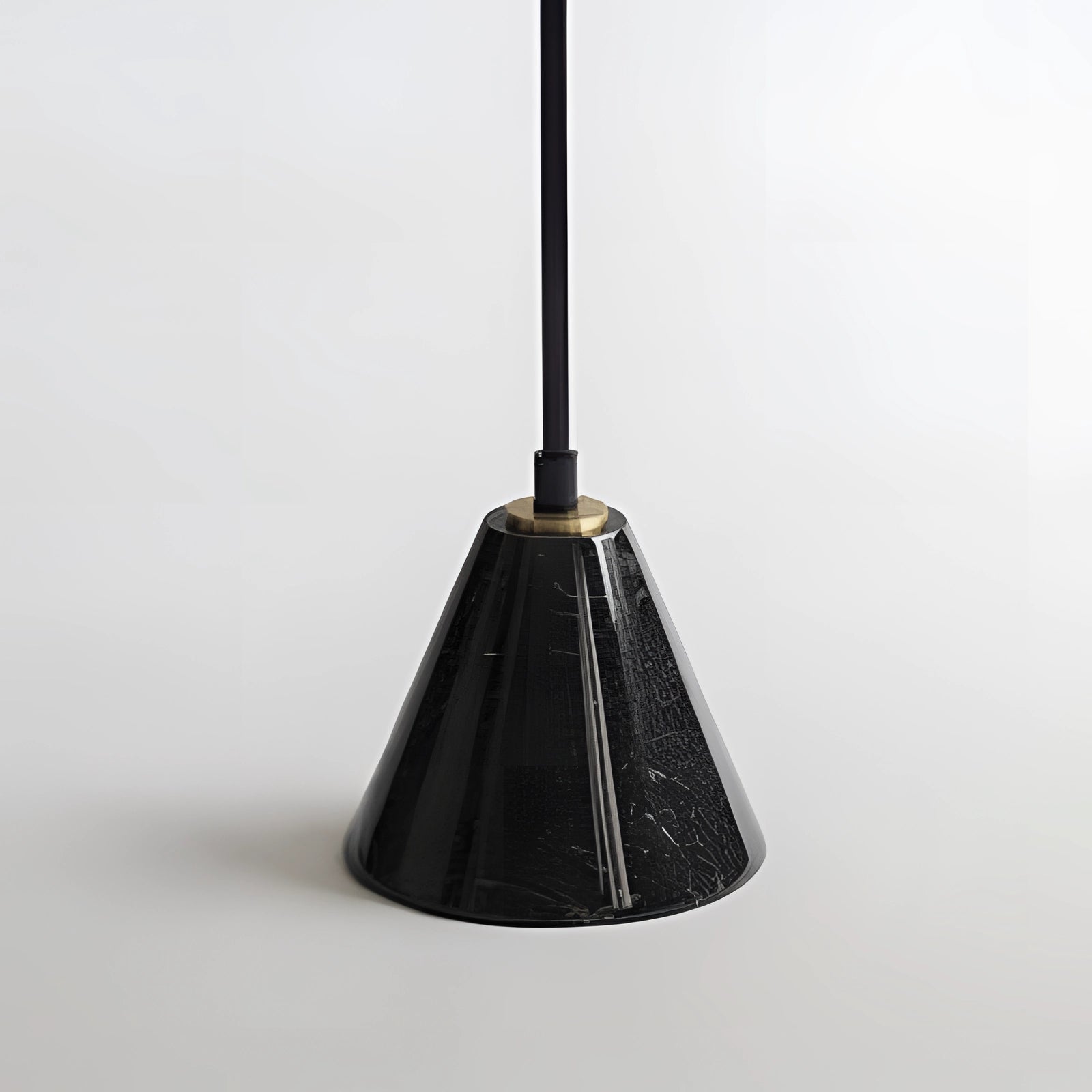 Arched minimalist floor lamp in modern black with a sculptural design, featuring a sleek metal frame and a cone-shaped lighting fixture, adding a contemporary touch to any room.