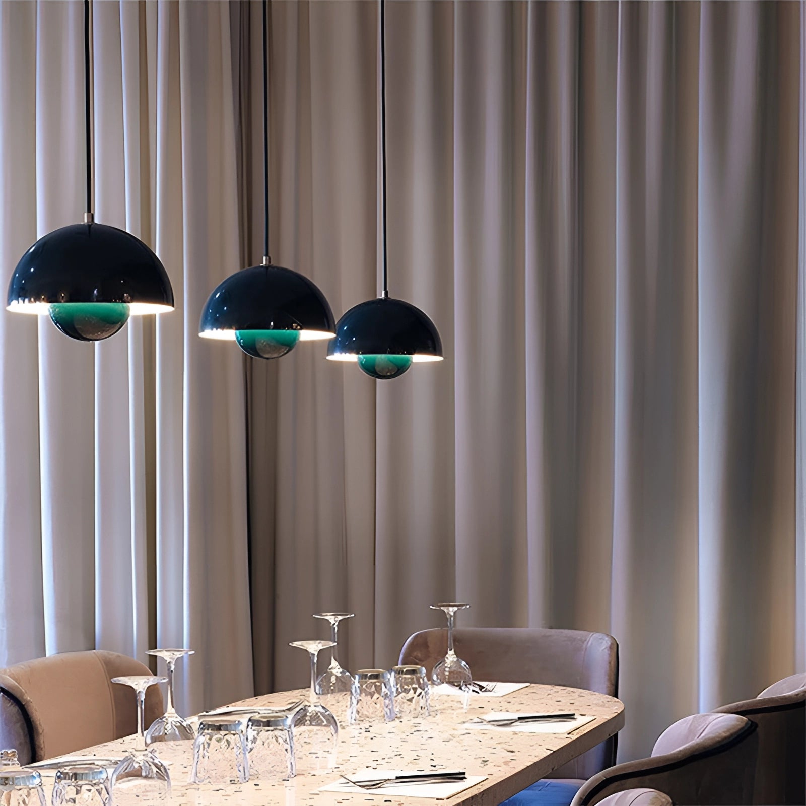 Auroraglo V2 Colorful Pendant Lights - Modern Retro Yellow, White, Orange, hanging above a wooden dining table with chairs, surrounded by various tableware and textile decorations, featuring a stylish and cozy interior design.