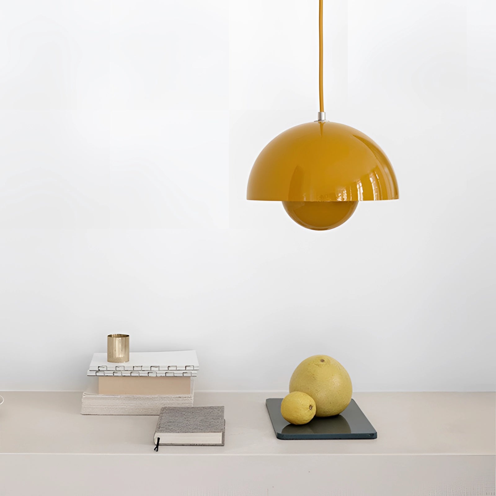 Auroraglo V2 Colorful Pendant Lights in modern retro yellow, white, and orange shades, featuring a wooden accent, mounted on a wall.