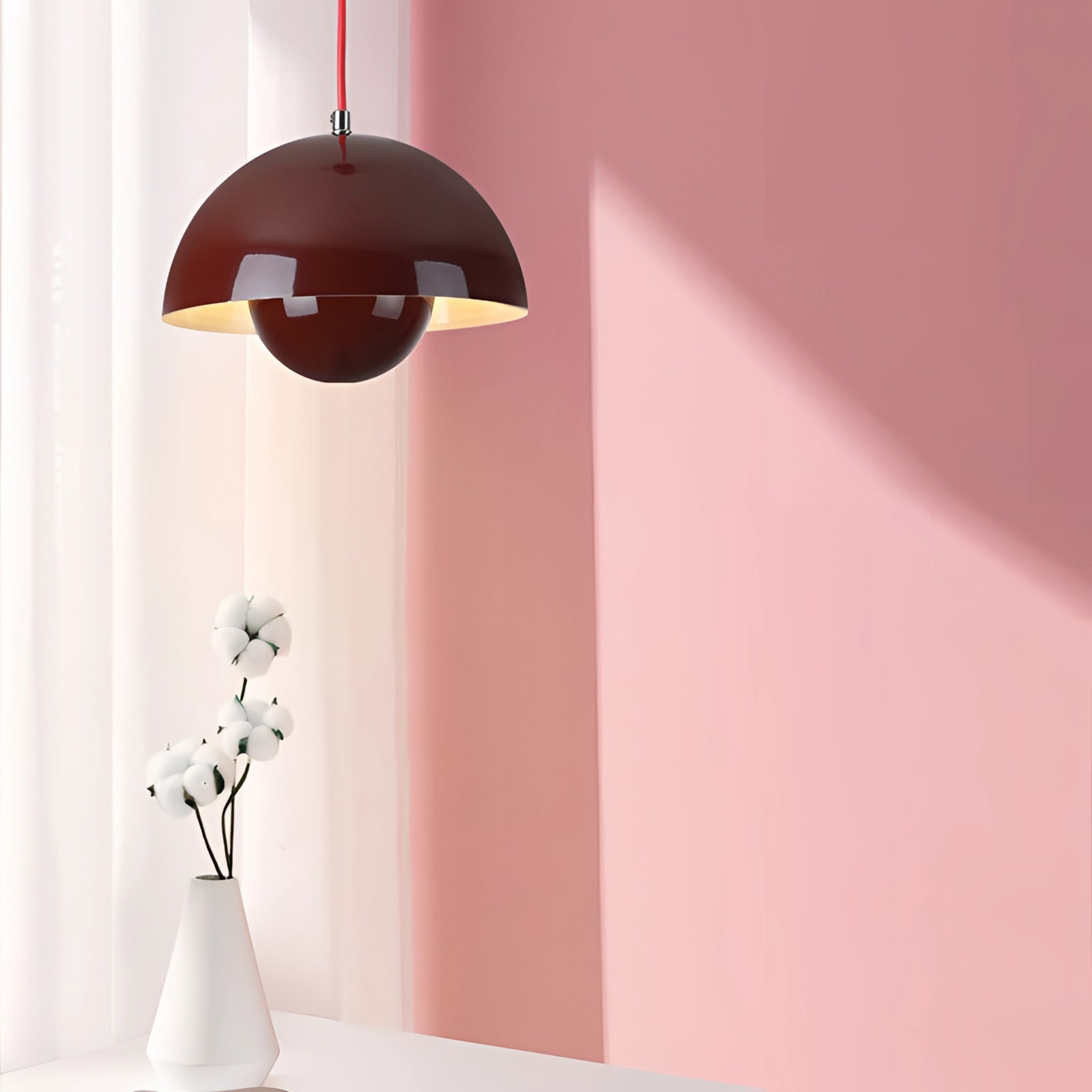 Modern retro pendant lights in yellow, white, and orange, featuring a sleek and colorful design.
