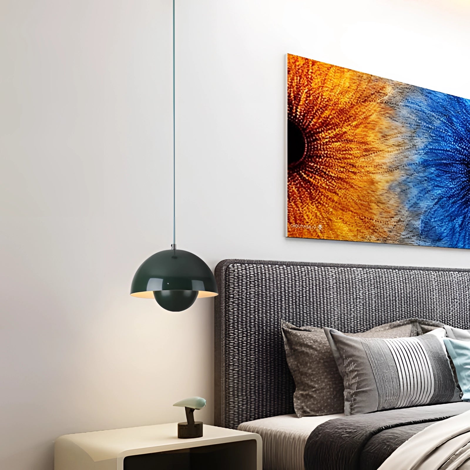 Modern retro living room with Auroraglo V2 colorful pendant lights in yellow, white, and orange hanging above a comfortable couch, wooden floor, and stylish decor.