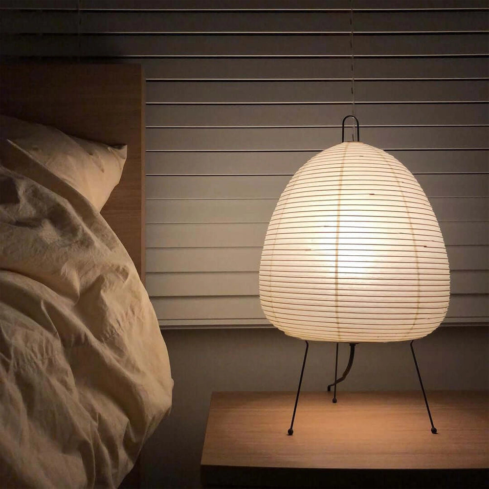 Unique sculptural tripod floor lamp with a wooden base and beehive-inspired shade, perfect for artistic statement lighting in any space.