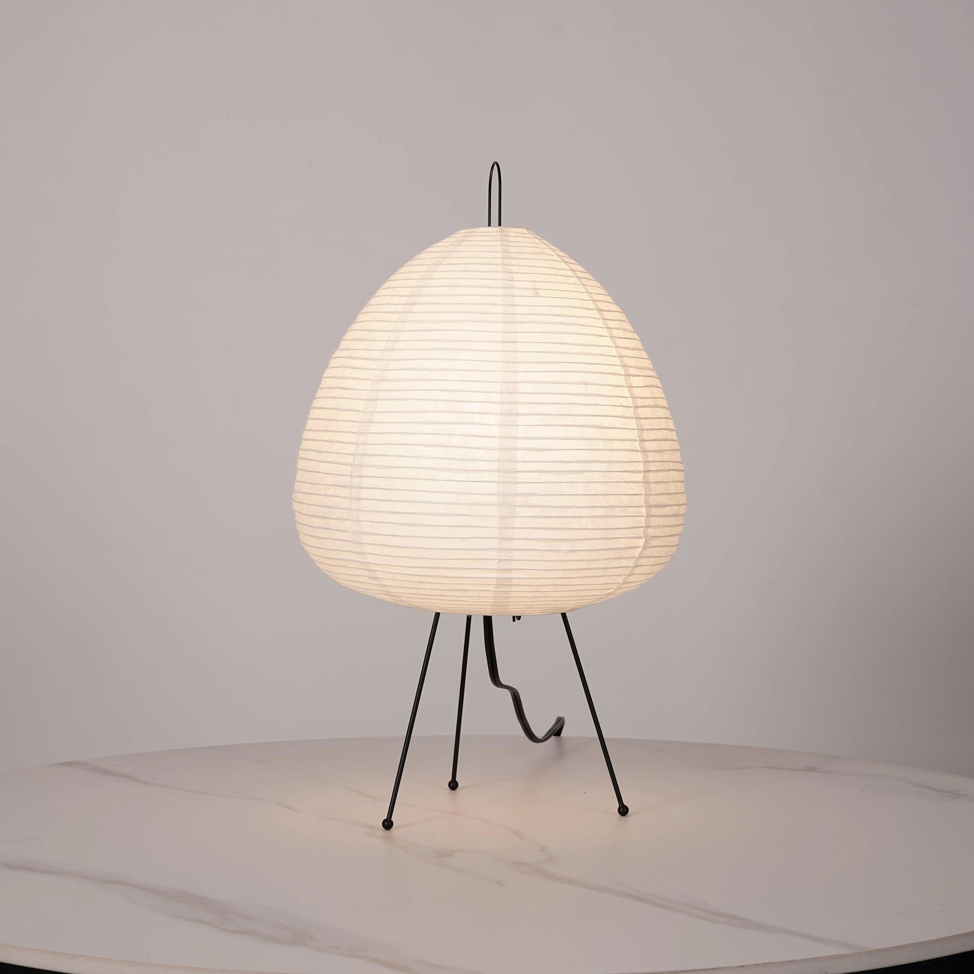 Unique sculptural tripod floor lamp with a beehive design, featuring wooden elements and a circular lampshade, ideal for adding an artistic statement to any room.
