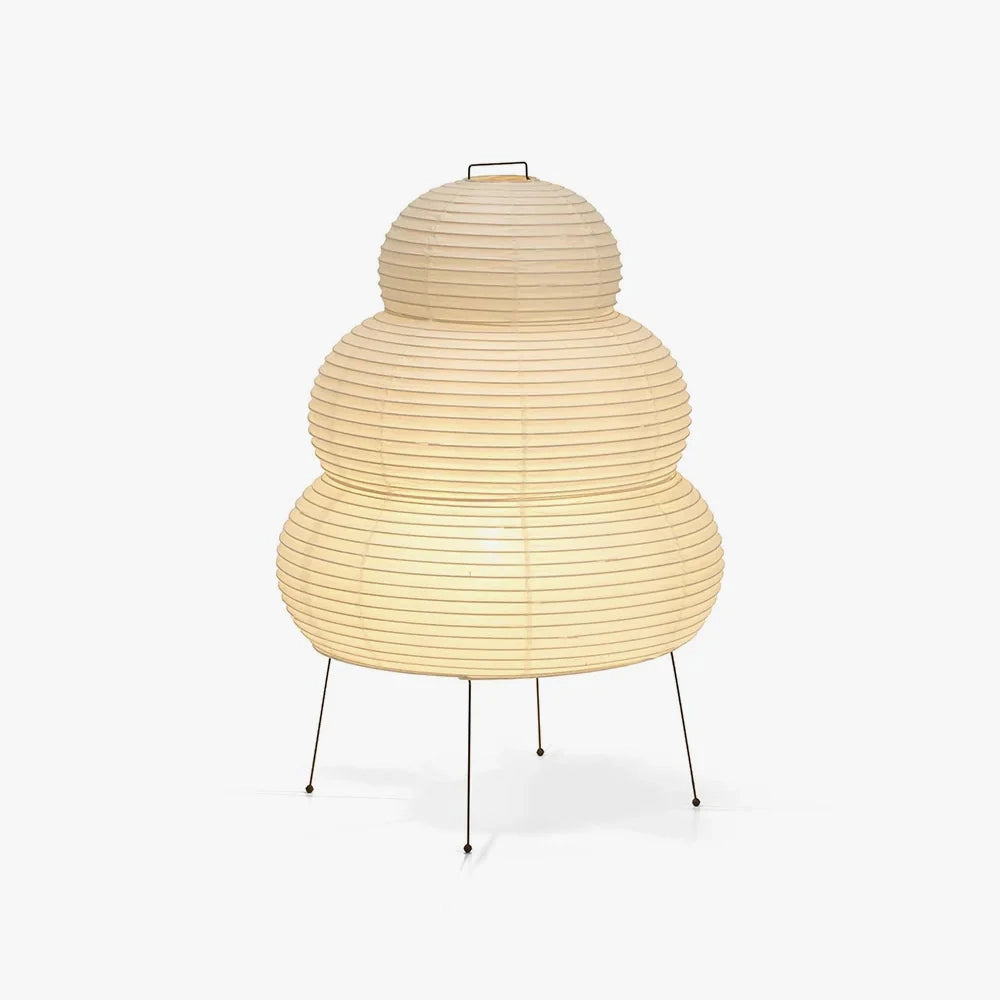 A unique Beehive Sculptural Tripod Floor Lamp with a dome-shaped metal light fixture on a tripod base, designed as a statement lighting piece for modern interiors.