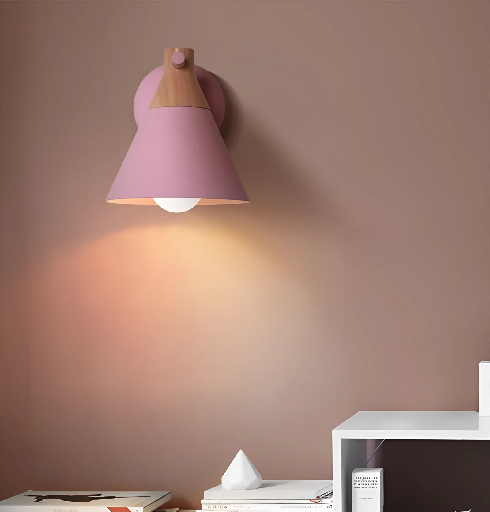 Beige adjustable LED wall lamp with a modern Nordic minimalist design in a pink variant, featuring a white light, wood accents, and sleek lines, mounted on a wall.