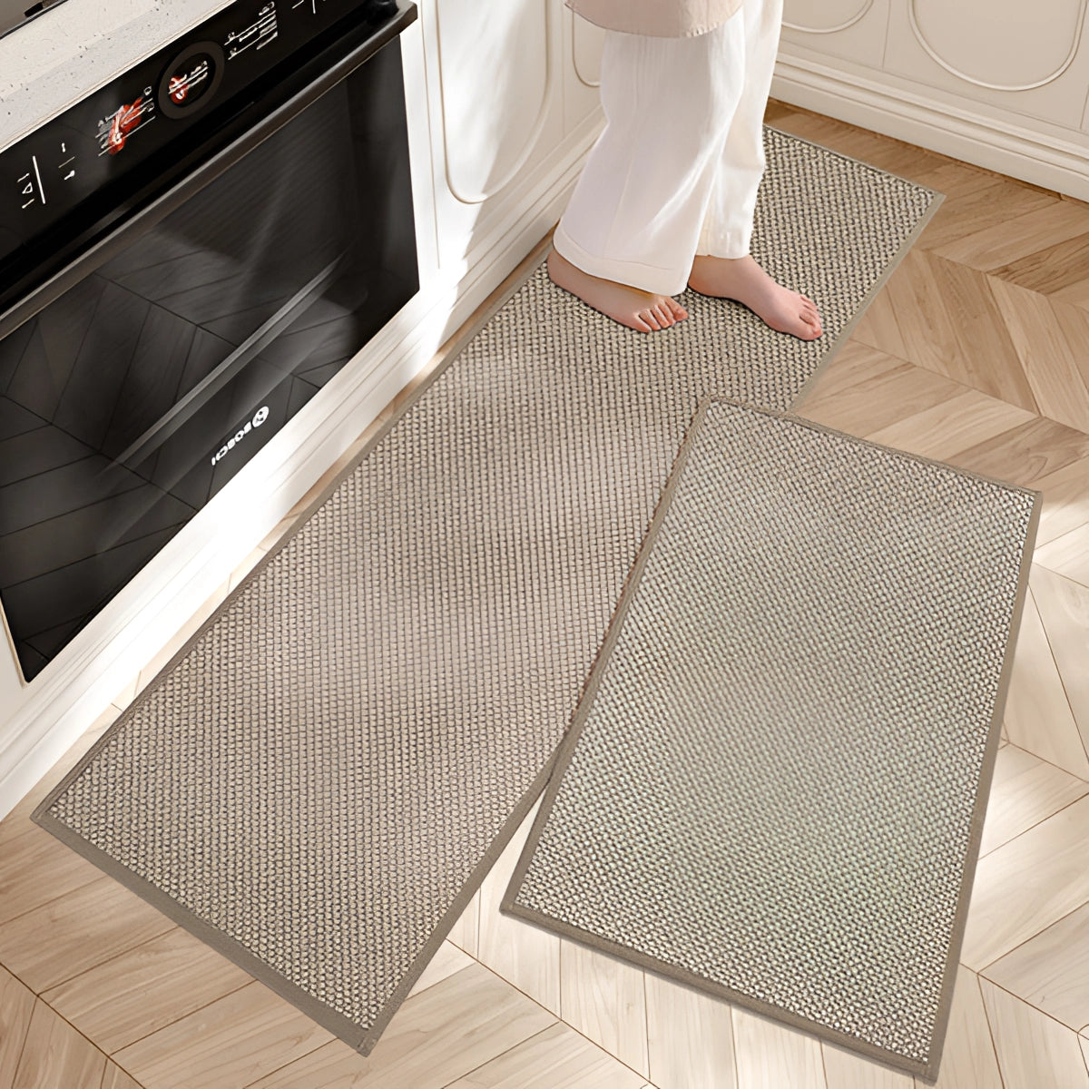Beige non-slip anti-fatigue kitchen runner mat placed on hardwood and tile flooring, designed to provide comfort and ease while standing, with a clean and modern rectangular design suitable for kitchen use.