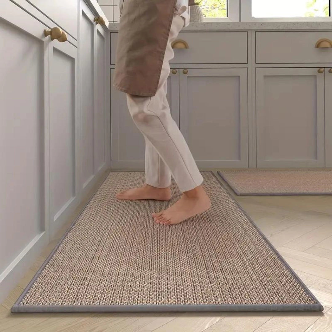 Grey non-slip anti-fatigue kitchen runner mat on a hardwood floor.
