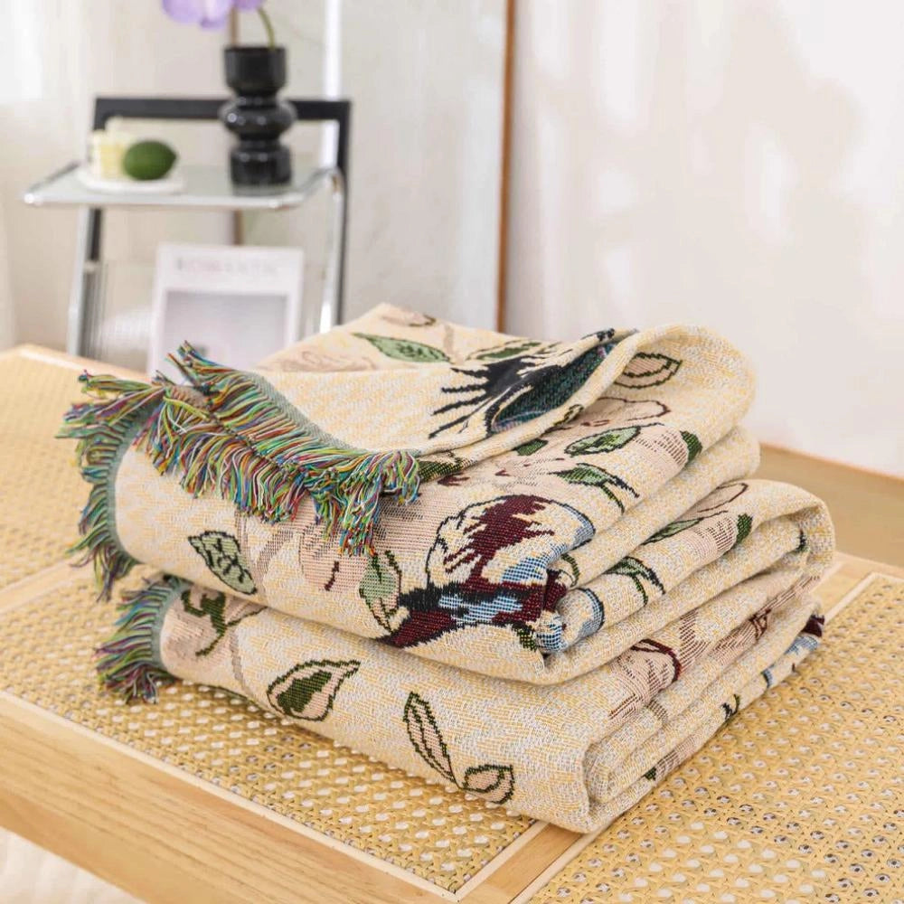 A bird-themed floral quilt featuring intricate botanical designs, perfect for nature-inspired decor.