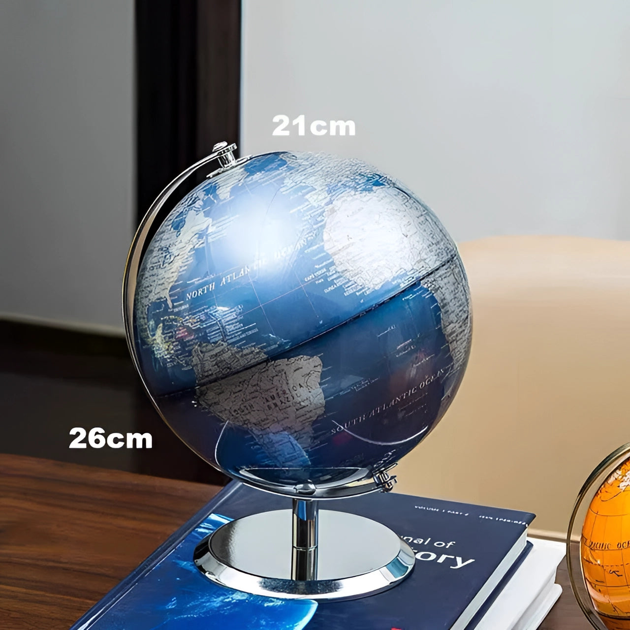 Black cork globe with electric blue accents, used for displaying world maps, measuring 24cm in diameter, and includes pins for marking locations.