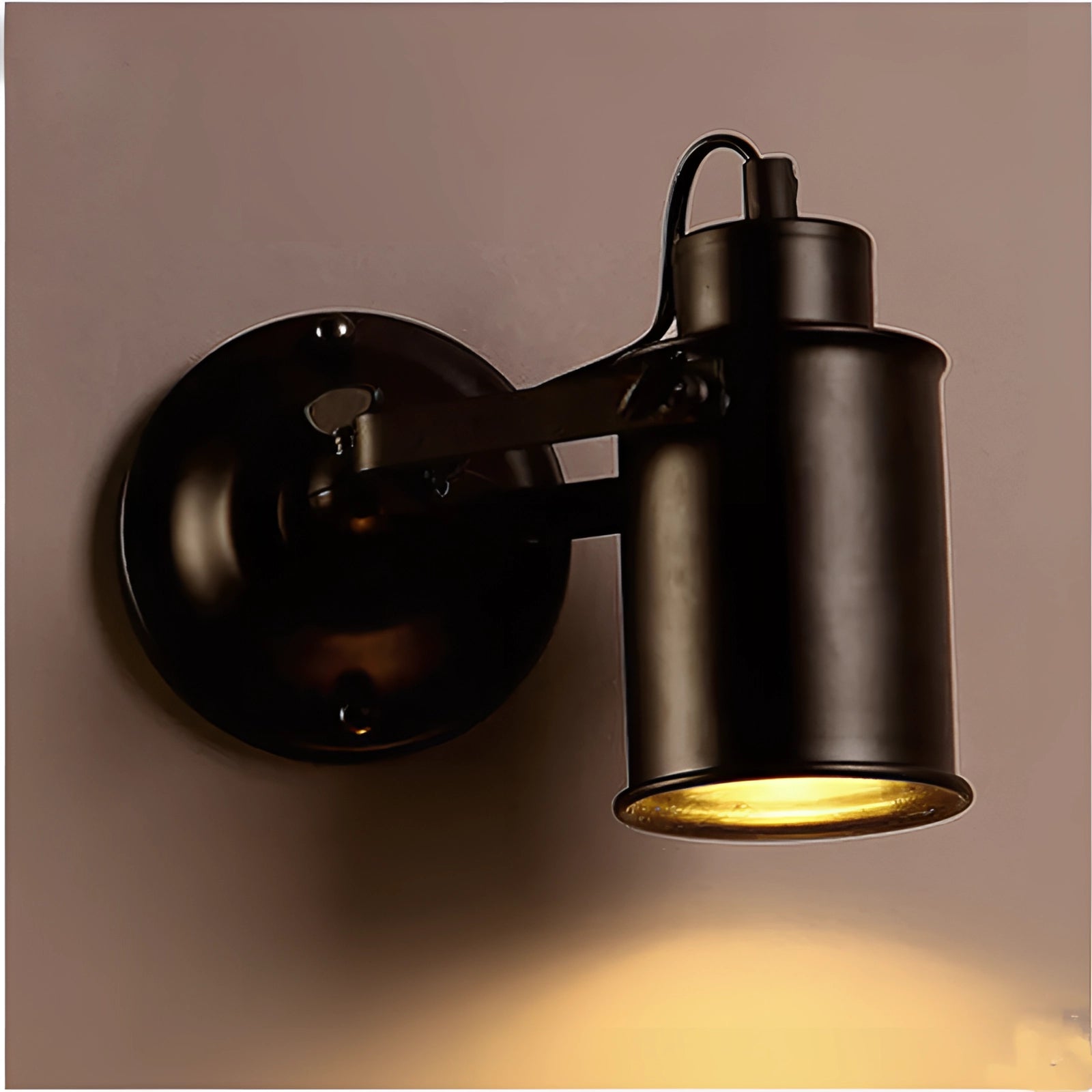 Black industrial wall lamp with an adjustable arm, featuring a matte finish. The sconce design is sleek and modern, suitable for various interior styles.