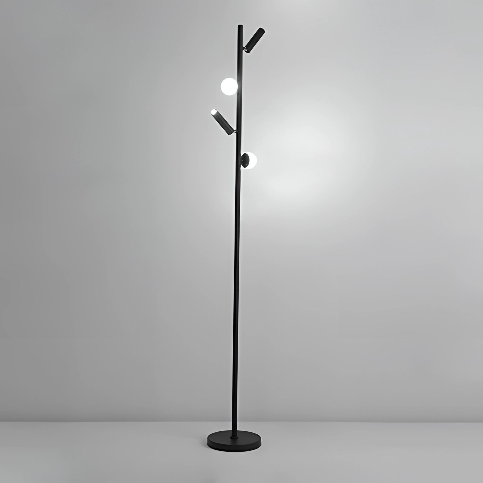 Black minimalist coat stand with a modern, sleek design featuring a textured black finish and a white light at the top, standing freestanding.