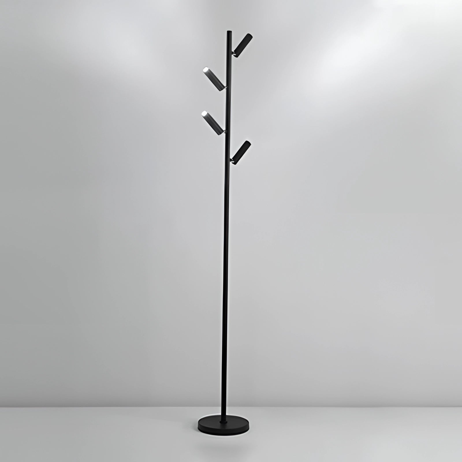 Black minimalist coat stand with a modern and sleek design, featuring a freestanding rack structure placed in a stylish interior setting.