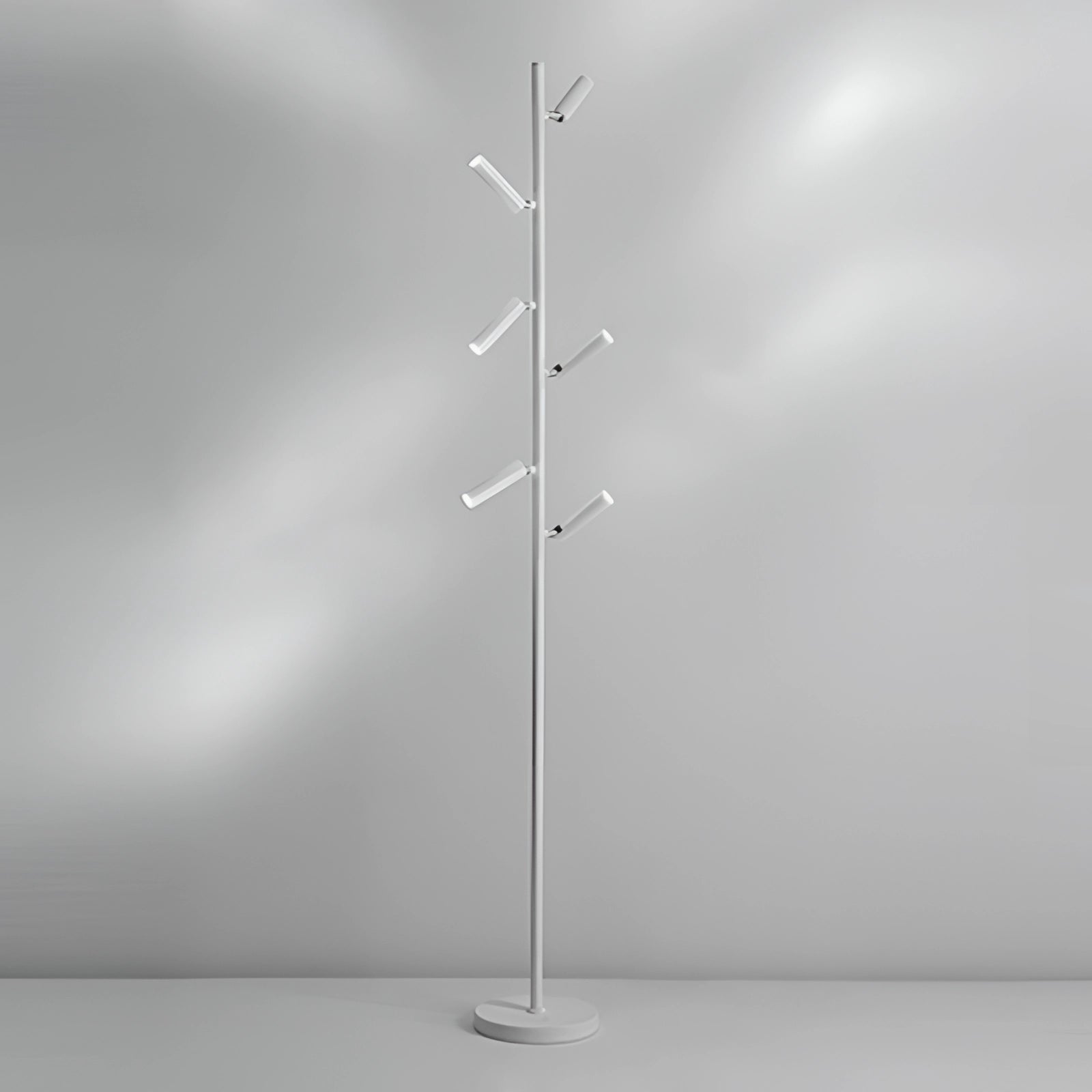 Sleek and modern freestanding coat stand in a minimalist design, featuring a textured white finish with six arms, standing elegantly against a softly illuminated background.