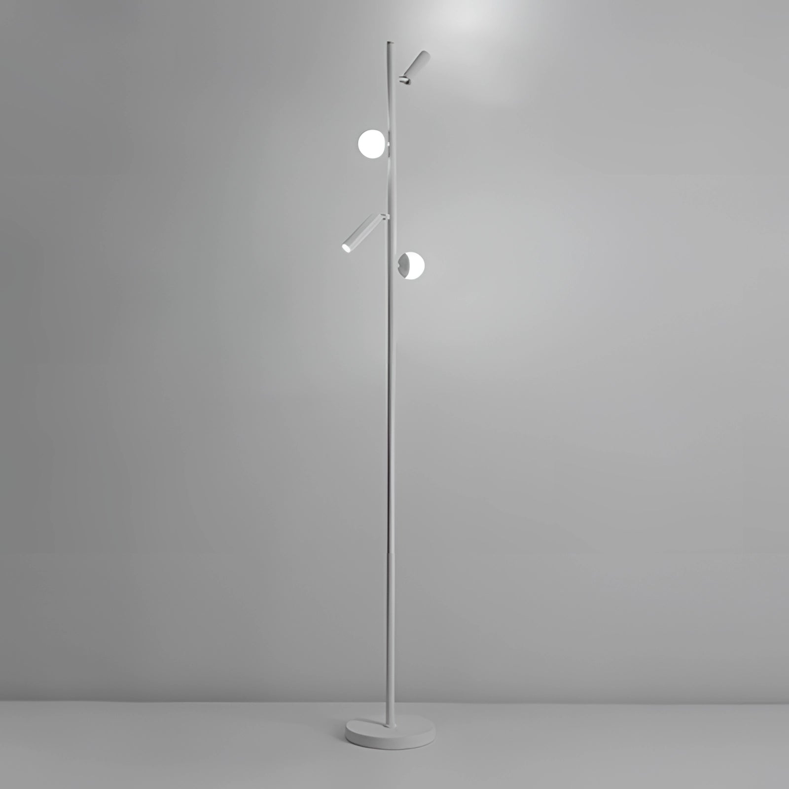 Modern minimalist freestanding coat stand with a sleek design in textured white finish, featuring four hooks, photographed in a monochrome setting.
