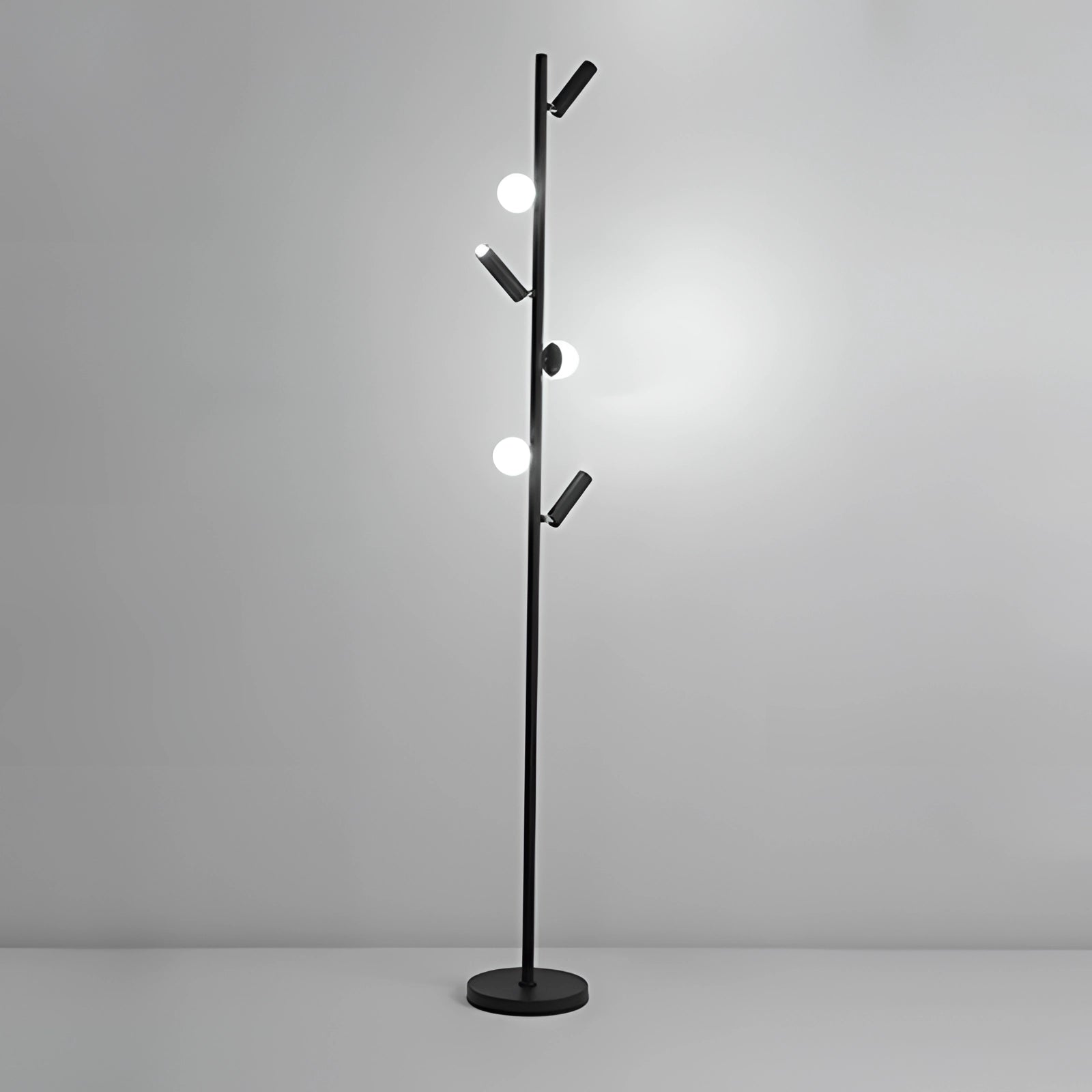 Modern black minimalist coat stand with a sleek freestanding design, featuring a streamlined silhouette and smooth finish.